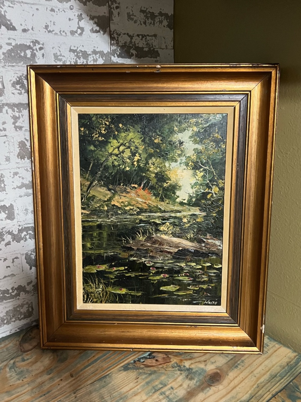 Vintage framed oil painting on canvas depicting a wooded landscape creek scene